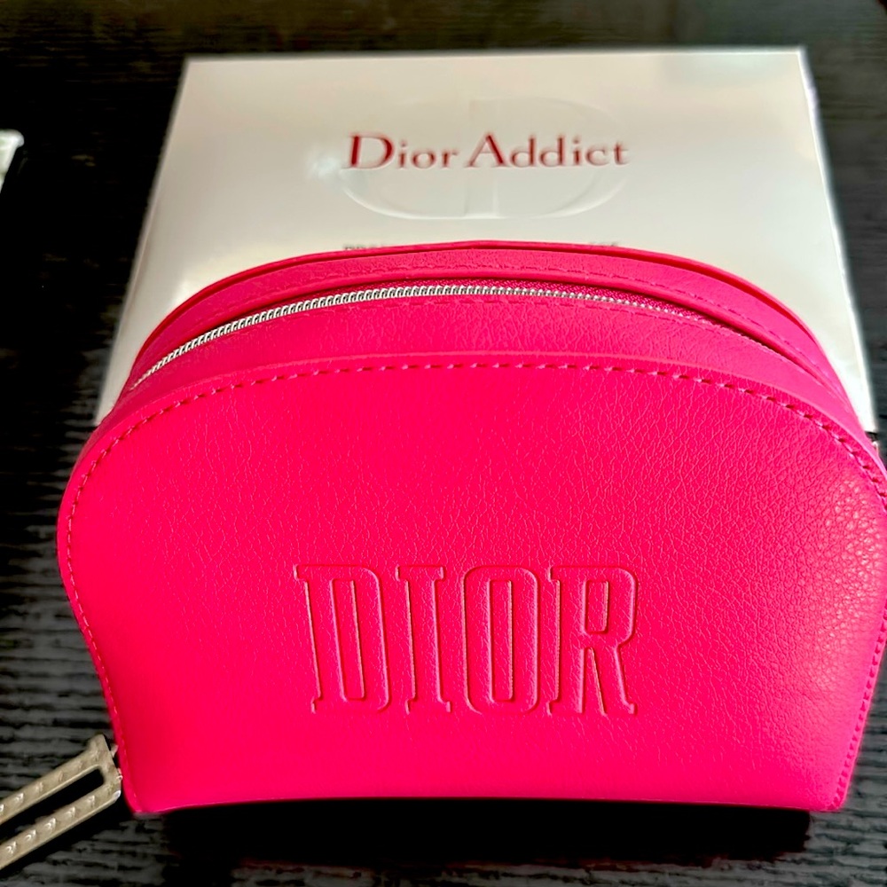 Gorgeous roomy pink case/clutch by Dior.  Has classic D logo zipper. Fair offers